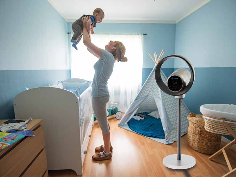 AirGuard 360 in a Baby Room with a Woman holding a smiling baby.