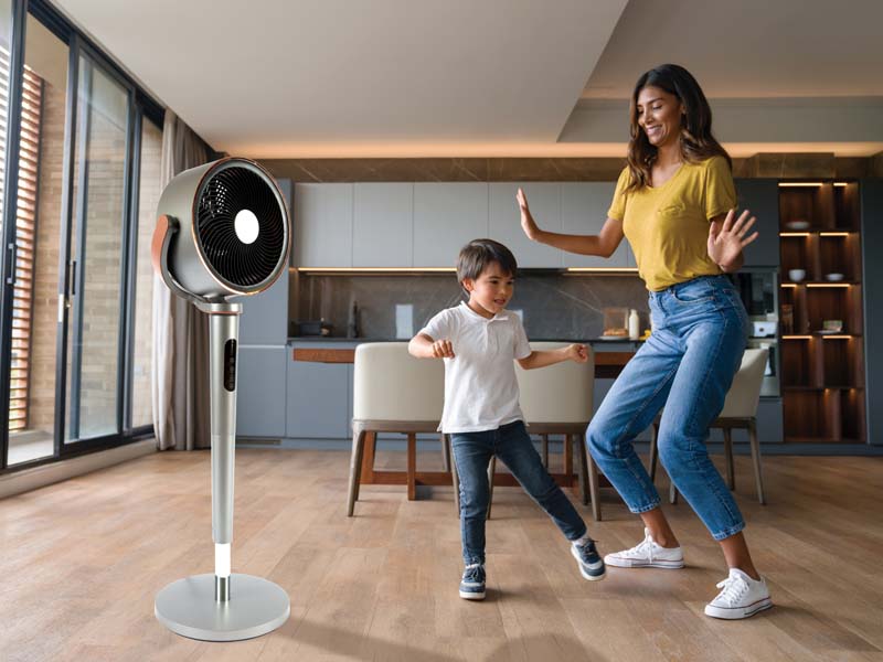 BreezeMaster 360 in a room with a mother and young son dancing